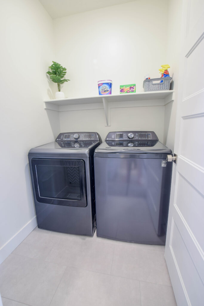 Laundry room with full-size washer and dryer