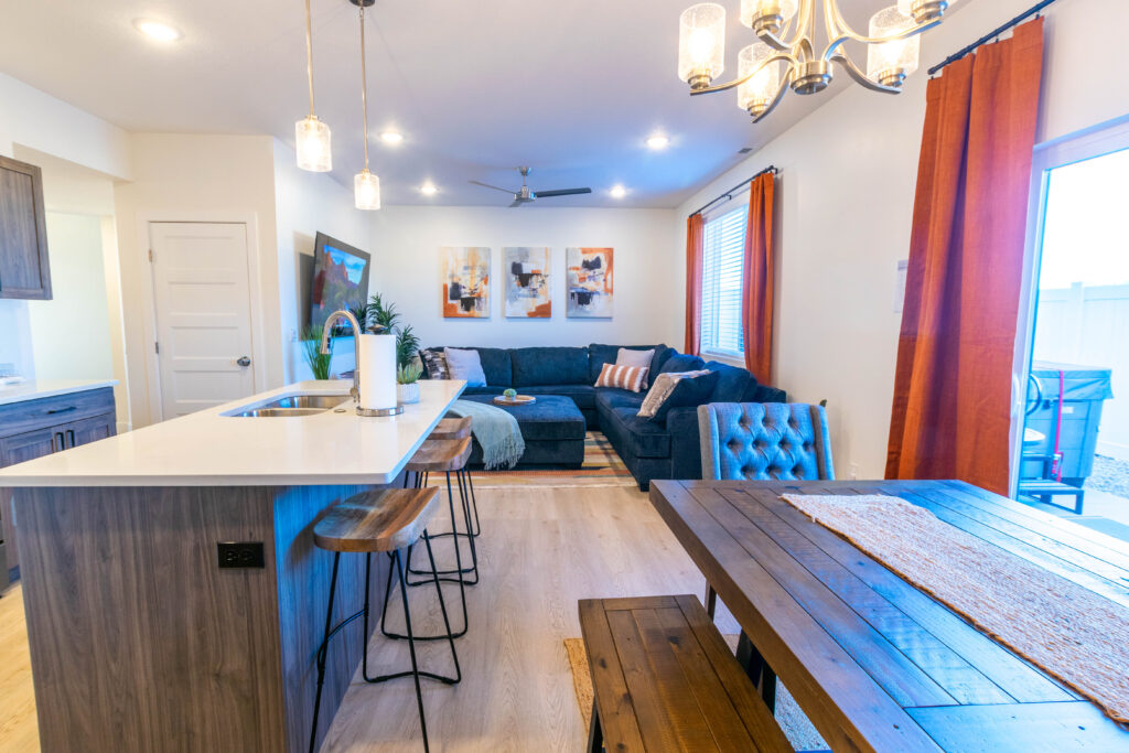 Kitchen island with bar seating beside the dining table
